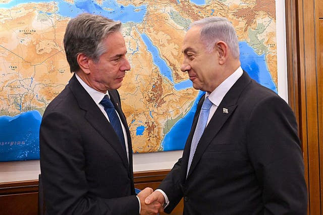 <p>Antony Blinken, left, greets Benjamin Netanyahu ahead of talks on Monday</p>